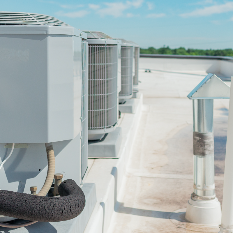 Condenser equipment on the rooftop of a large building